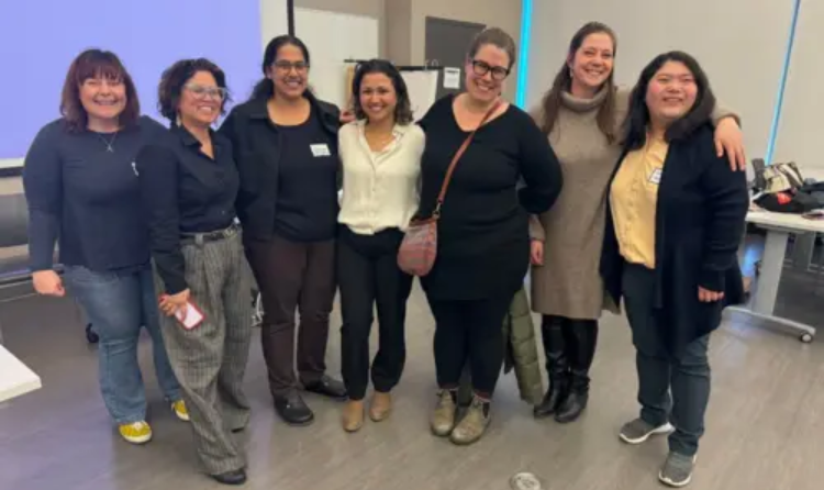 Social Work Group picture of 7 people standing together