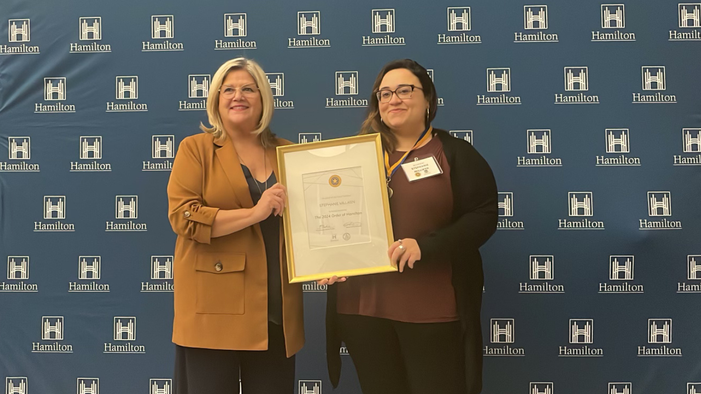 Stephanie Milliken accepting her award from Mayor Horwath.